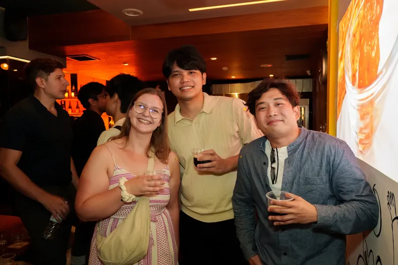 Guests smiling together over drinks