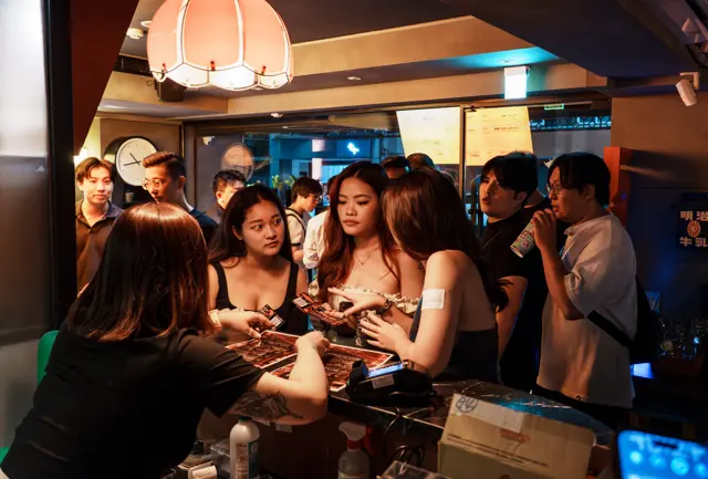 Guests gathering at the bar counter