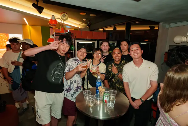 A group smiling together inside the Friday venue