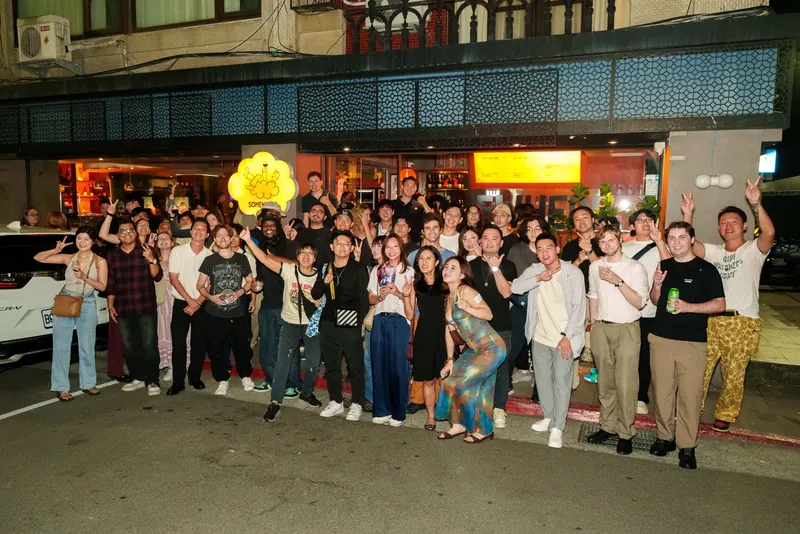 The Friday group posing together outside the venue