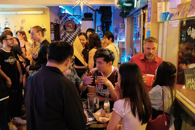 Guests talking around tables at Tea Bar