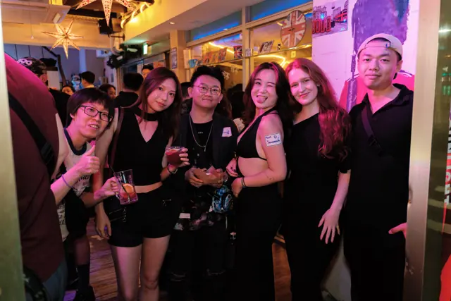 Friends smiling for a photo inside Tea Bar