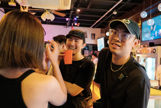 Guests chatting near the bar