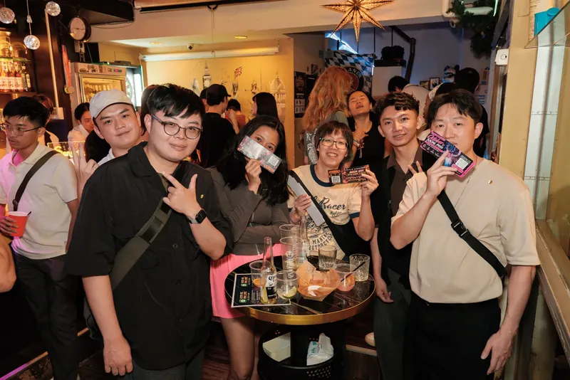 A group posing around a table
