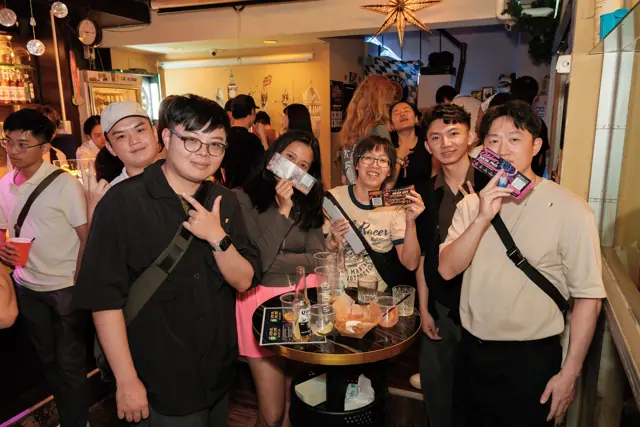 A group posing around a table